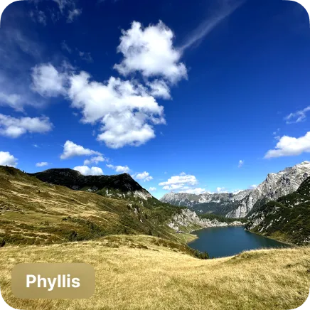 photo of a alpine lake in front of mountains