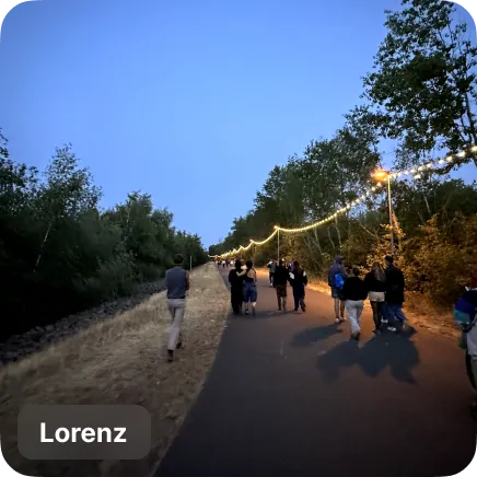 photo of people walking on a path in nature