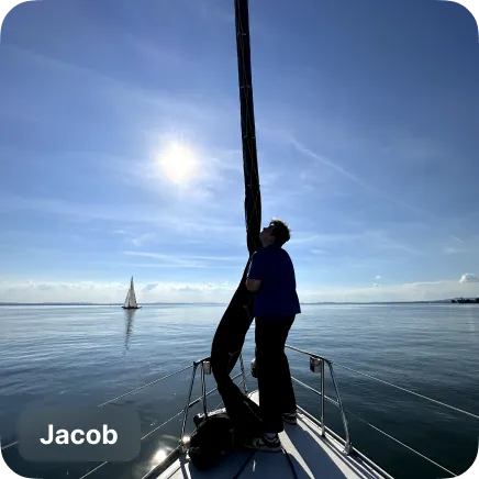 photo of a man on a sail boat